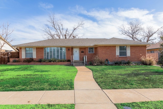 ranch-style home with a front lawn