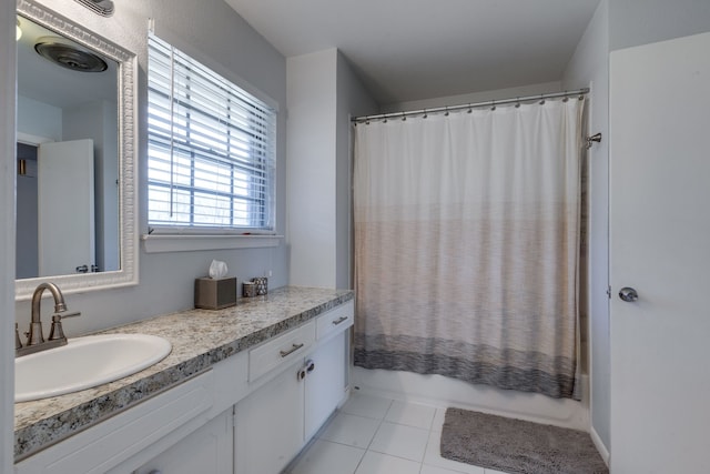 bathroom featuring vanity, tile patterned floors, and shower / bath combo