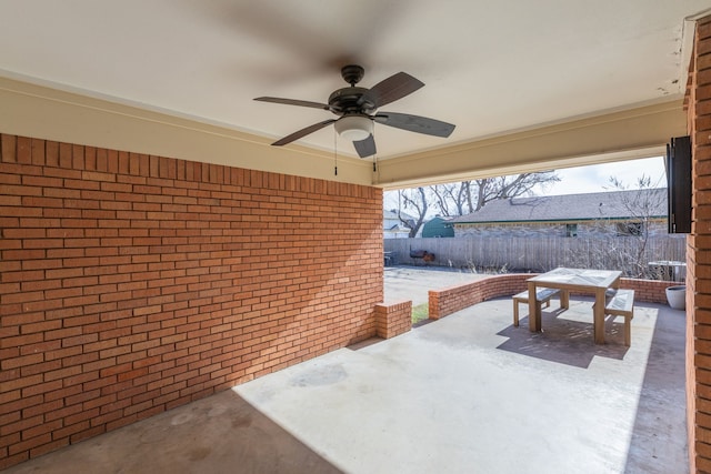 view of patio featuring ceiling fan