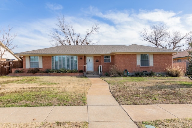 ranch-style house with a front lawn