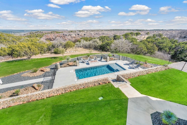 view of swimming pool featuring a yard and a patio