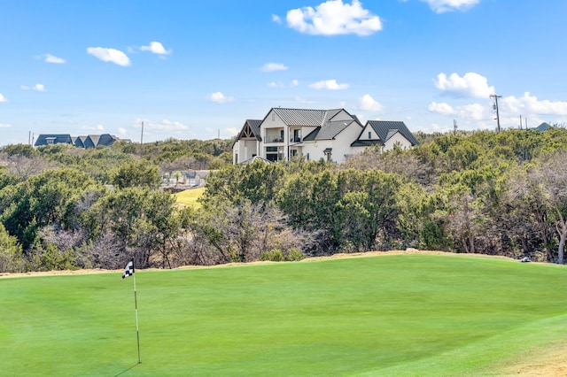 view of property's community with a yard