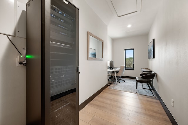 hall with light hardwood / wood-style floors