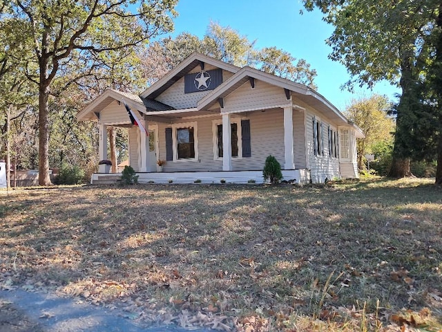 view of front of home featuring a front lawn and a porch