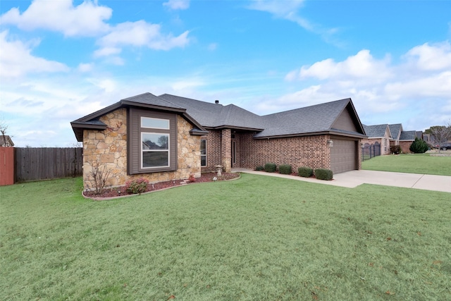 view of front of property with a garage and a front yard