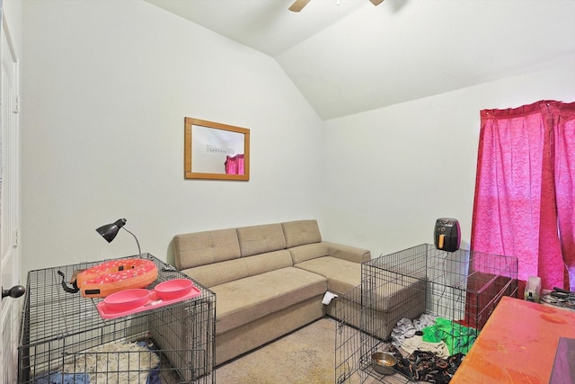 living room featuring ceiling fan and vaulted ceiling