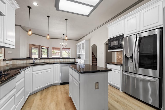 kitchen featuring sink, white cabinets, and stainless steel appliances