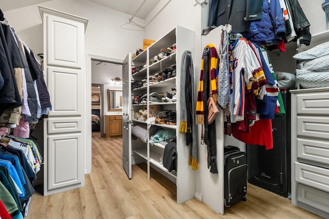 walk in closet featuring light hardwood / wood-style floors