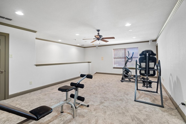 workout room featuring ceiling fan, light colored carpet, and ornamental molding