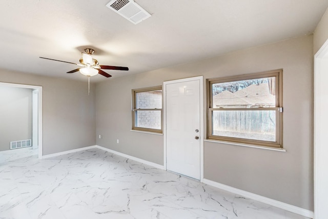 entrance foyer with ceiling fan