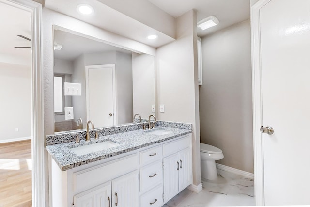 bathroom with vanity and toilet