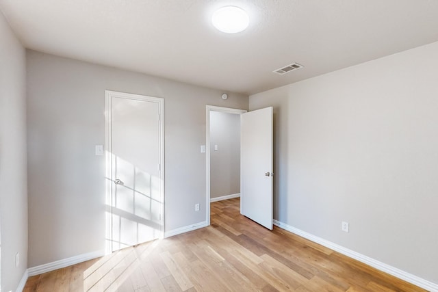 spare room featuring light wood-type flooring