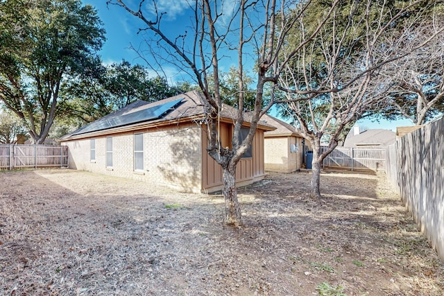 view of home's exterior with solar panels