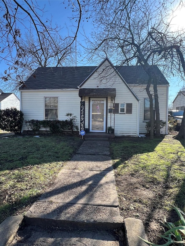 ranch-style home with a front lawn