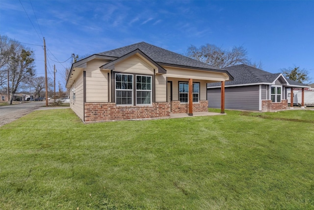 view of front of home with a front lawn and covered porch