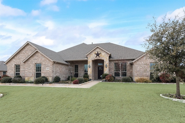 french country style house featuring a front yard