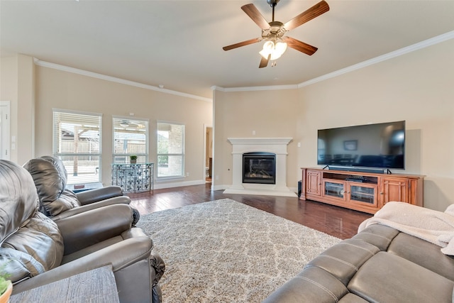 living room with dark hardwood / wood-style flooring, ornamental molding, and ceiling fan