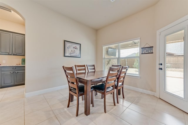 dining area featuring light tile patterned flooring