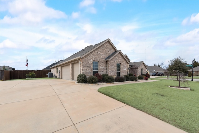 view of front of home featuring a front yard and a garage