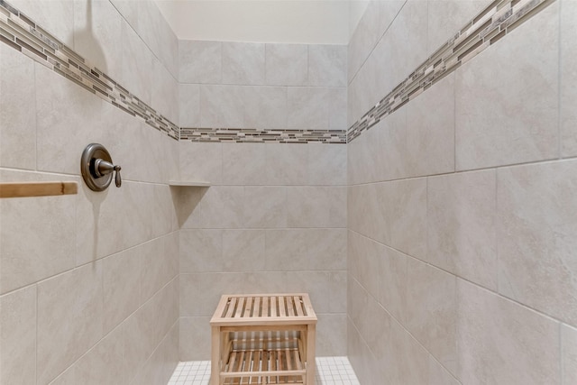 bathroom with a tile shower