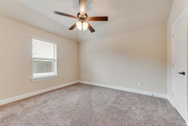 unfurnished room featuring ceiling fan and carpet