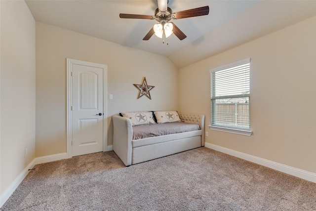 living area with lofted ceiling, light colored carpet, and ceiling fan