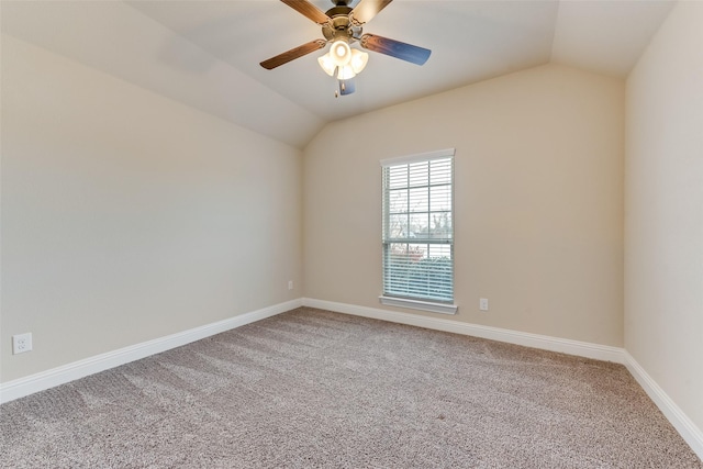 carpeted spare room with lofted ceiling and ceiling fan