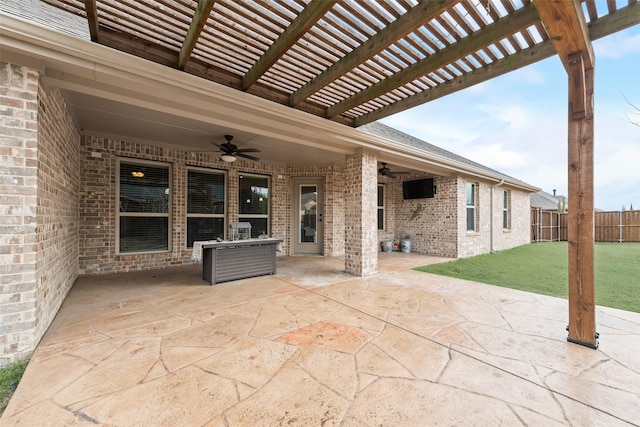 view of patio / terrace with ceiling fan and a pergola