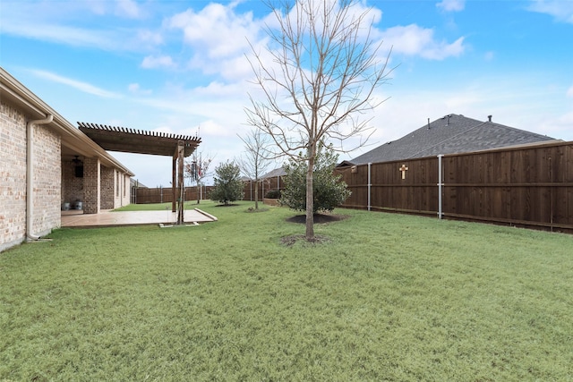 view of yard with a pergola and a patio