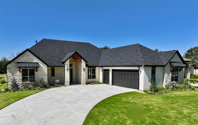 view of front facade with a garage and a front yard