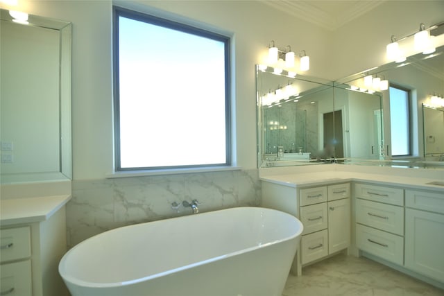 bathroom featuring vanity, plenty of natural light, and ornamental molding