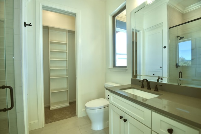 bathroom with walk in shower, vanity, and toilet