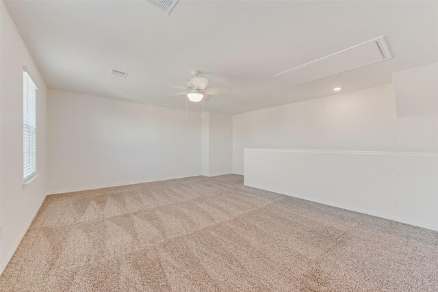 carpeted empty room with ceiling fan