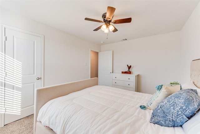 bedroom with visible vents and a ceiling fan