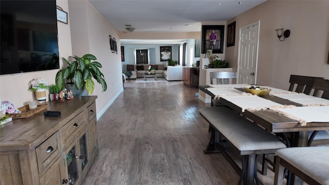 dining room featuring dark wood-type flooring