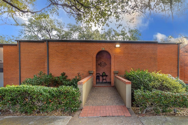 view of exterior entry at dusk