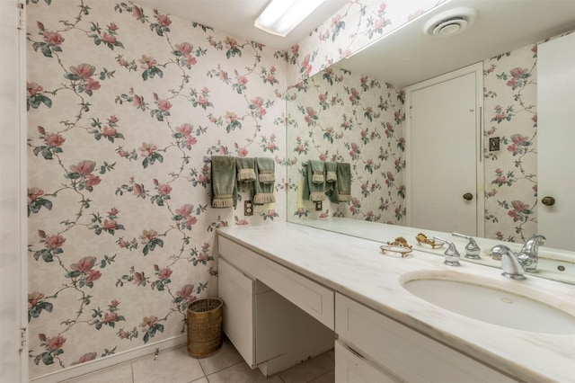 512 E Ave J Unit A, Grand Prairie, TX 75050 - bathroom with tile patterned flooring, wallpapered walls, vanity, and baseboards