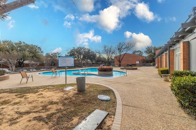 view of pool featuring a pergola and a patio area