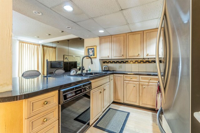 512 E Ave J Unit A, Grand Prairie, TX 75050 - kitchen featuring freestanding refrigerator, black dishwasher, a sink, dark countertops, and a peninsula