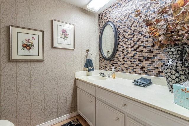 512 E Ave J Unit A, Grand Prairie, TX 75050 - bathroom featuring wallpapered walls and vanity