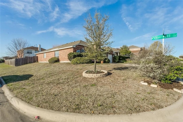 view of front of house with a garage and a front yard