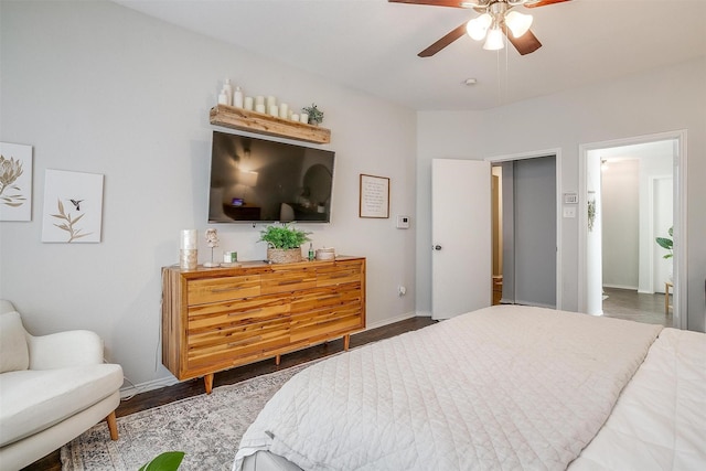 bedroom featuring ceiling fan and dark hardwood / wood-style flooring