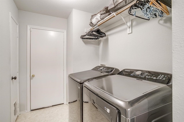 washroom with washer and clothes dryer