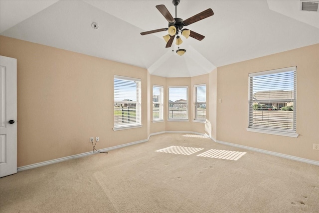 empty room with ceiling fan, light carpet, and lofted ceiling