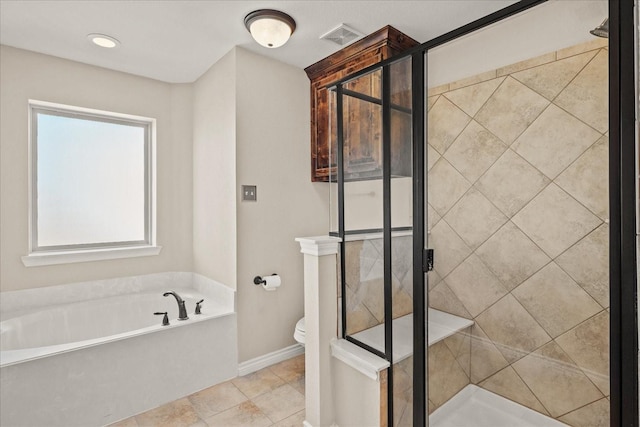 bathroom with separate shower and tub and toilet