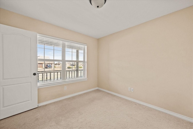 empty room featuring light carpet