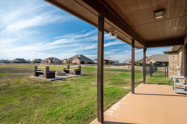 view of yard with an outdoor fire pit and a patio