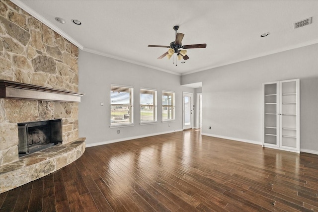 unfurnished living room featuring ceiling fan, crown molding, a fireplace, and dark hardwood / wood-style floors