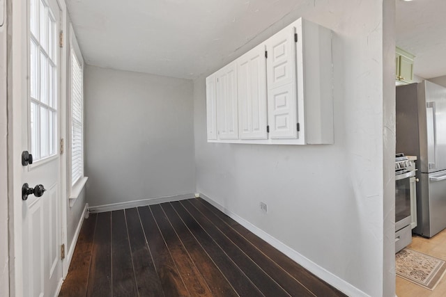 unfurnished room featuring hardwood / wood-style flooring