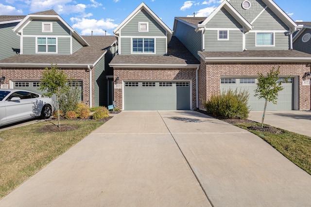 view of front facade with a garage and a front lawn